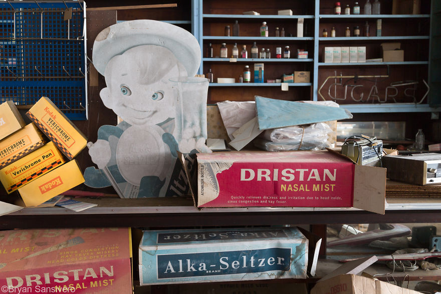 Vintage advertising and shelves with bottles