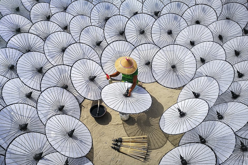 Among the white umbrellas