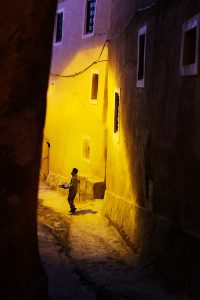 A young boy selling products in the streets of Ouarzazate, Morocco