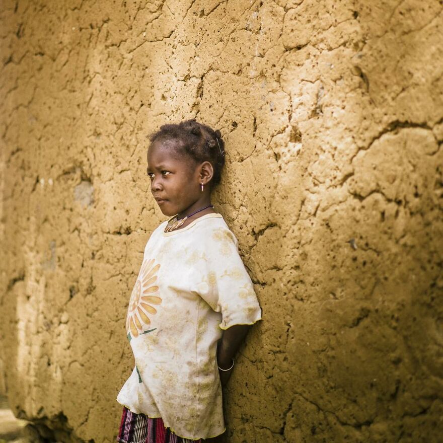 Young Girl Standing In Front Of A Traditional House In Fada N’Gourma