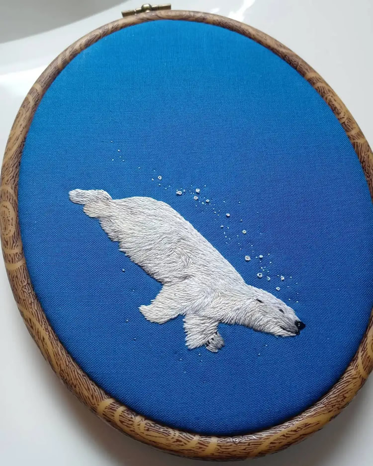 Embroideries Of Animals Plunging Into The Water by Megan Zaniewski